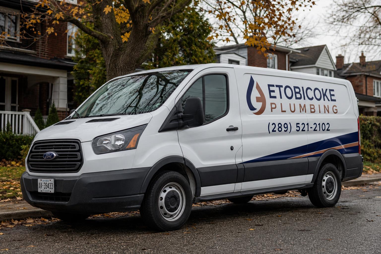 Etobicoke Plumbing service van branded with the phone number (289) 521-2102, parked on an Etobicoke street